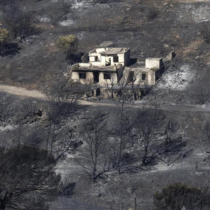Two wildfires are burning near Greece's capital, fueled by strong winds